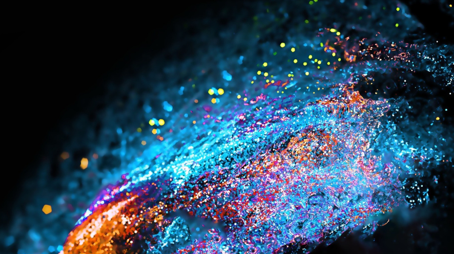 Abstract blue and orange digital particles forming a dynamic wave on a dark background.